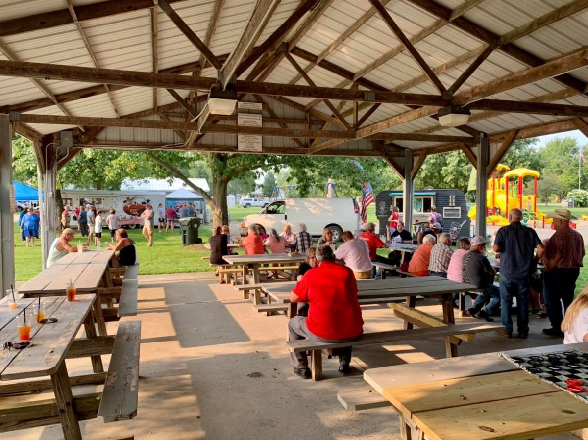 residents eating food in the pavilion