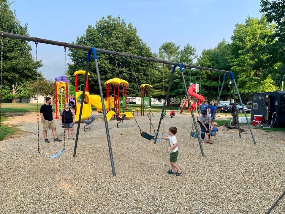 Kids and parents at the swing set